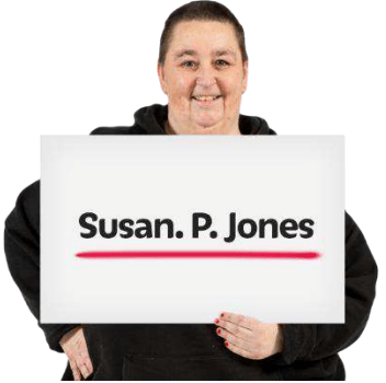 person holding up a banner with their name